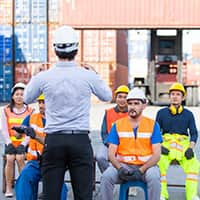 Construction workers being taught by an instructor